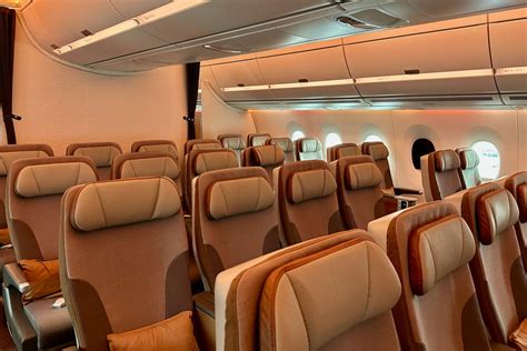 interior view of Airbus A350 premium economy cabin with mood lighting and wide seats