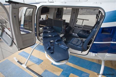 Interior view of Bell 407 medical evacuation configuration with stretchers and advanced life support gear