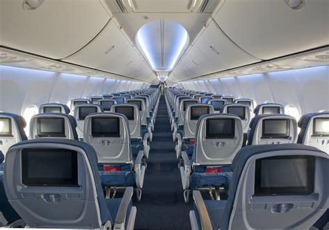 interior view of delta boeing 737-800 cabin with passengers en route to orlando on saturday flight