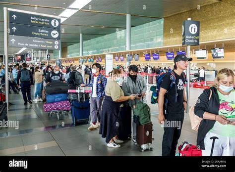Interior view of El Dorado Airport Terminal 1 showing check-in counters