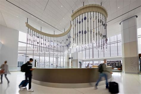 interior view of Harvey Milk Terminal 1 featuring sustainable architecture and digital signage