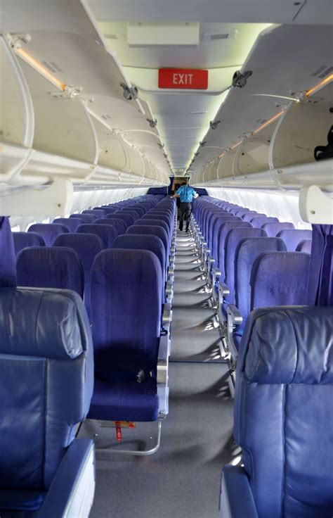 Interior view of Hawaiian Airlines Boeing 717 during boarding at Honolulu International Airport