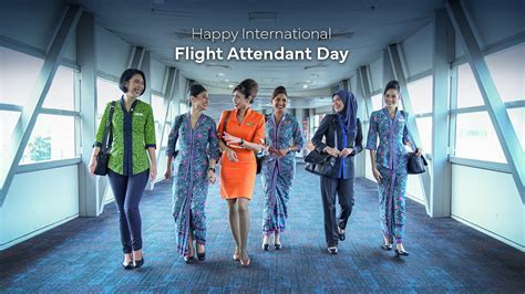 international flight attendants posing before boarding long-haul flight