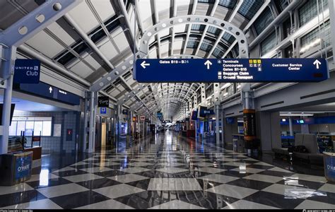 international flights departure board inside o’hare airport terminal