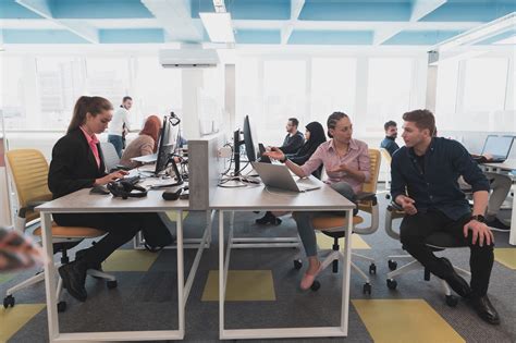 Interns collaborating in a modern SWISS office environment