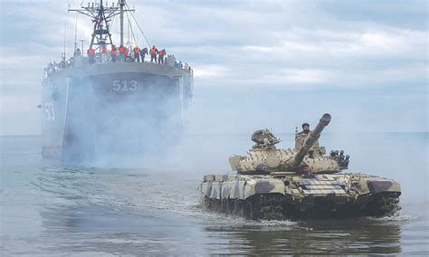 Iranian military drill Makran coast overlooking Strait of Hormuz missile launch