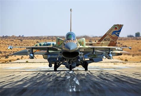 Israeli Air Force aircraft preparing precision bombs on flightline before long range mission