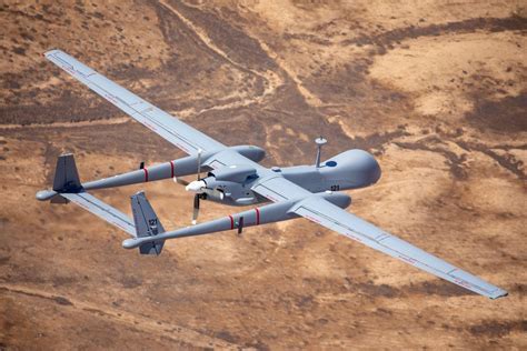 Israeli IAI Heron UAV mid-flight above mountainous terrain