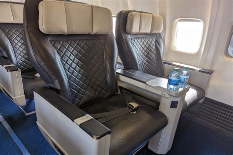 israir economy class cabin with visible seat layout and tray tables