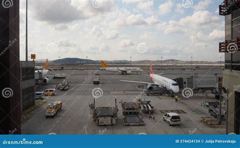 Istanbul Sabiha Gokcen Airport runway with narrowbody aircraft taxiing at sunset