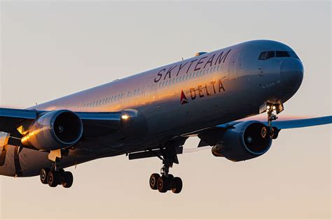 ITA Airways aircraft tail with SkyTeam livery parked at Fiumicino alongside partner aircraft