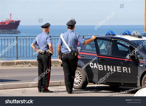 Italian Carabinieri conducting roadside ID check near Tuscany