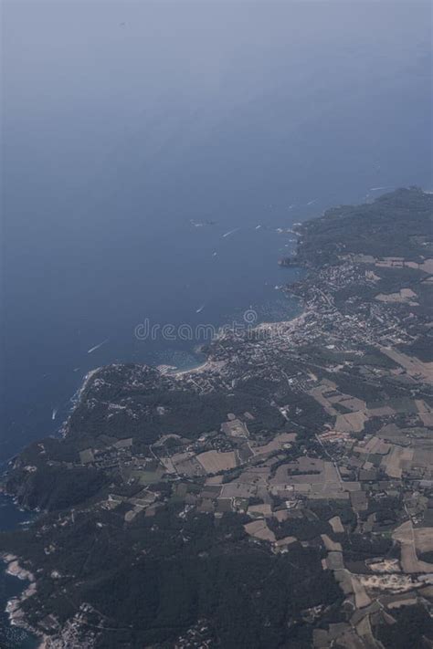 Italian coastline from airplane window during descent