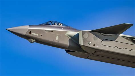 j-20 mighty dragon in night operation with glowing cockpit lights and stealth outline