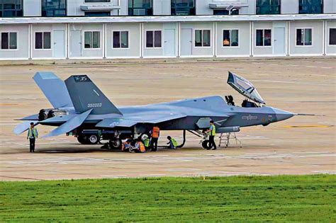J-35 prototype with folded wings on carrier deck trials