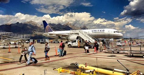 jackson hole airport terminal with united airlines aircraft parked at gate