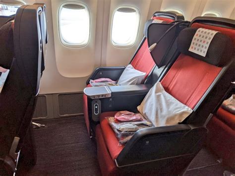 JAL Premium Economy seat with extended leg rest and amenity kit