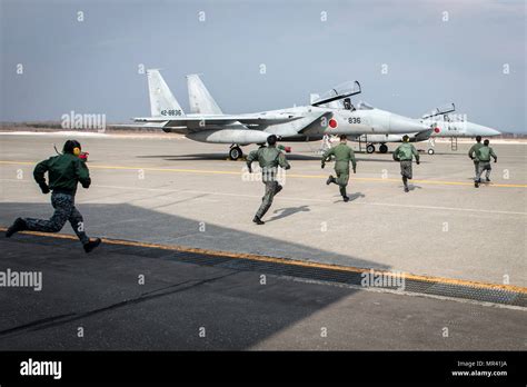 Japan Air Self-Defense Force F-15J pilots conducting scramble mission