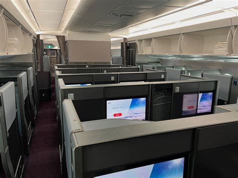 Japan Airlines Airbus A350-1000 business class suite with tall privacy door and large entertainment screen