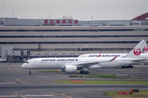 Japan Airlines aircraft at Tokyo Haneda Airport premium cabin branding