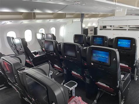 Japan Airlines premium economy seat with large entertainment screen and wide cushion