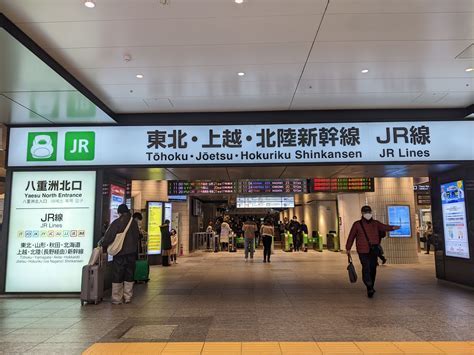 Japan Shinkansen at platform with tourist using JR Pass