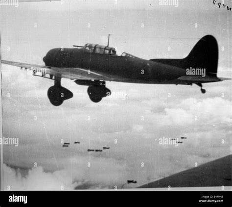 Japanese Aichi D3A1 Val dive bomber attacking American naval vessels during the Battle of Okinawa in 1945
