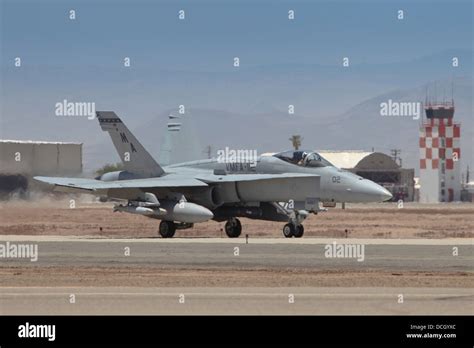 JDAM-equipped F/A-18 Hornet releasing bombs mid-flight