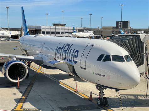 JetBlue aircraft parked at a gate at JFK’s Terminal 5