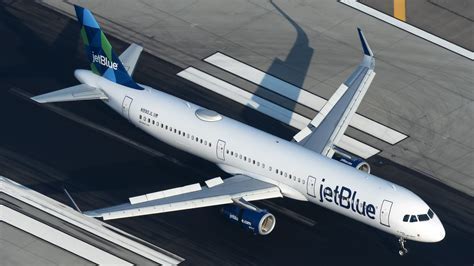 JetBlue planes lined up at Fort Lauderdale airport gates