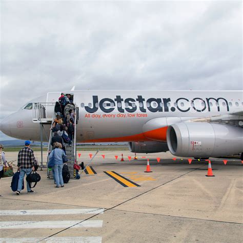 jetstar aircraft at gate with minimal passengers indicating declining pacific presence