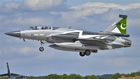 jf-17 thunder at defense expo with pakistan and saudi flags side by side