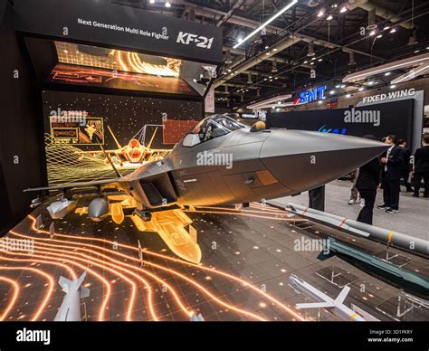 KAI KF-21 Boramae prototype in factory rollout with engineers in background