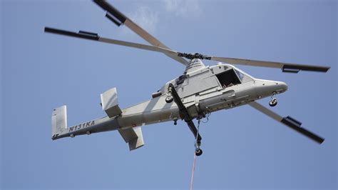 Kaman K-MAX aerial crane during timber extraction operation