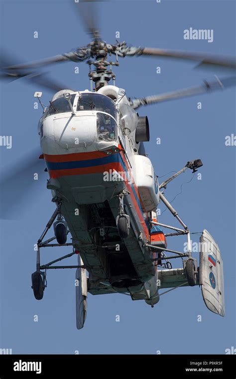 kamov ka-32 helicopter hovering above urban rooftop fire