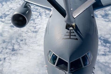 KC-46 Pegasus supporting F-35 fighter operations over Pacific Ocean