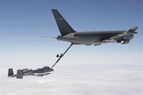 KC-46 refueling F-22 Raptor over Pacific Ocean long range mission