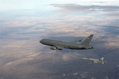 KC-46 tanker refueling an F-22 in combat simulation