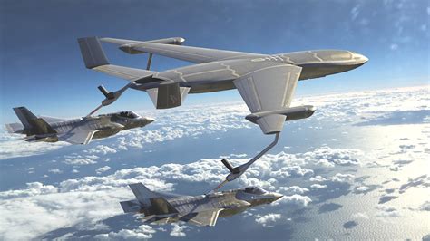 KC-46A refueling a fighter jet during nighttime operations over Pacific theater