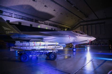 Kongsberg Joint Strike Missile being loaded on F-35 weapons bay