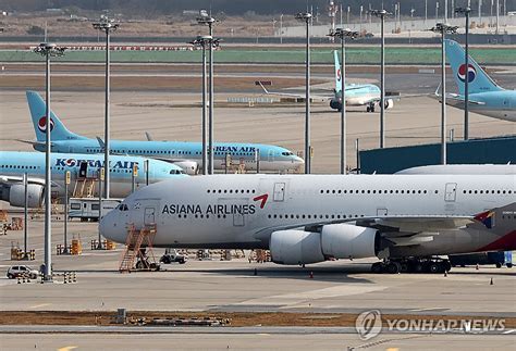 korean air and asiana aircraft at seoul incheon amid merger talks