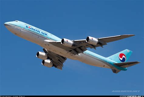 korean air boeing 747-8i landing at jfk international airport in winter fog