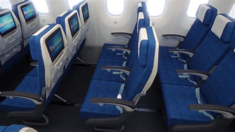 Korean Air Boeing 777 economy cabin with spacious blue seats
