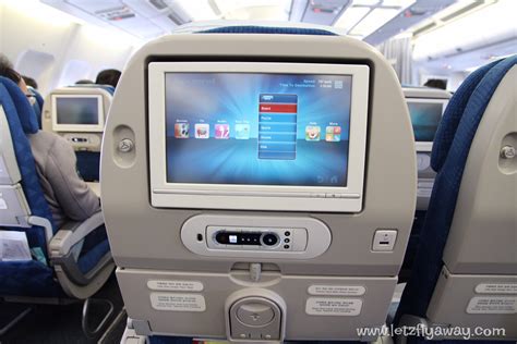 korean air economy class seat back with screen and legroom