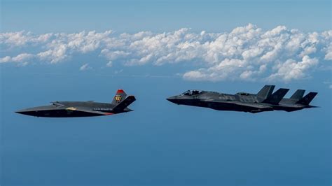 Kratos XQ-58A Valkyrie in formation flight with F-35 fighter jet