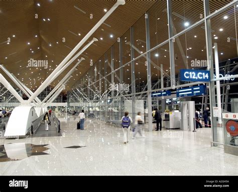 Kuala Lumpur International Airport terminal night aircraft departure