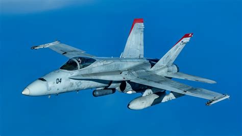 Kuwait Air Force F/A-18C Hornet refueling midair during coalition operations