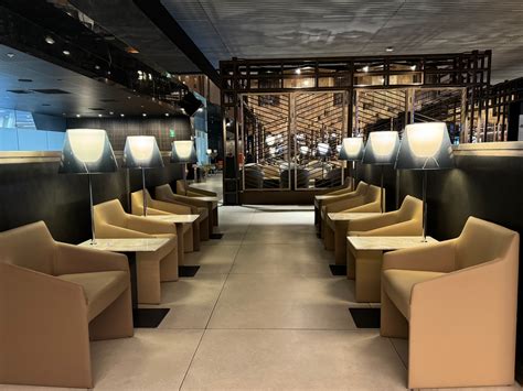 LATAM Lounge in Santiago with modern wood accents and buffet area