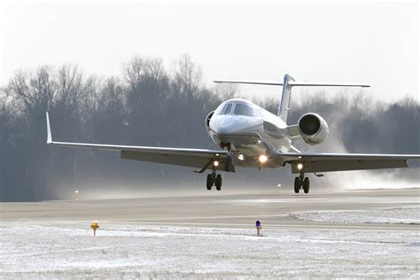 Learjet 60 private jet taking off for short regional flight mission