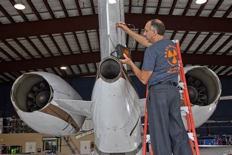 level III ndt inspector reviewing radiographic testing results for aircraft landing gear component